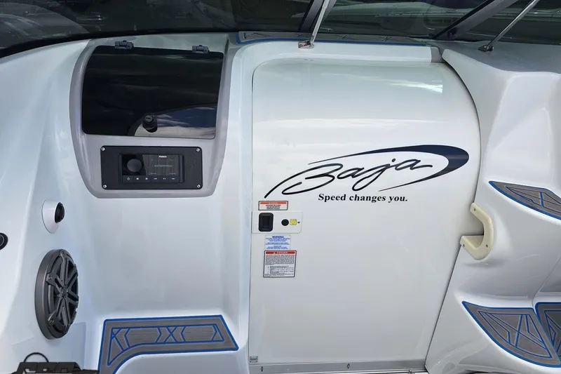 Slide: The Image of 2005 Baja 275 boat interior with logo and control panel. - 62