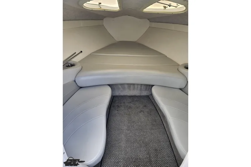 Slide: The Image of 2005 Baja 275 boat interior with gray seating and carpeted floor. - 72