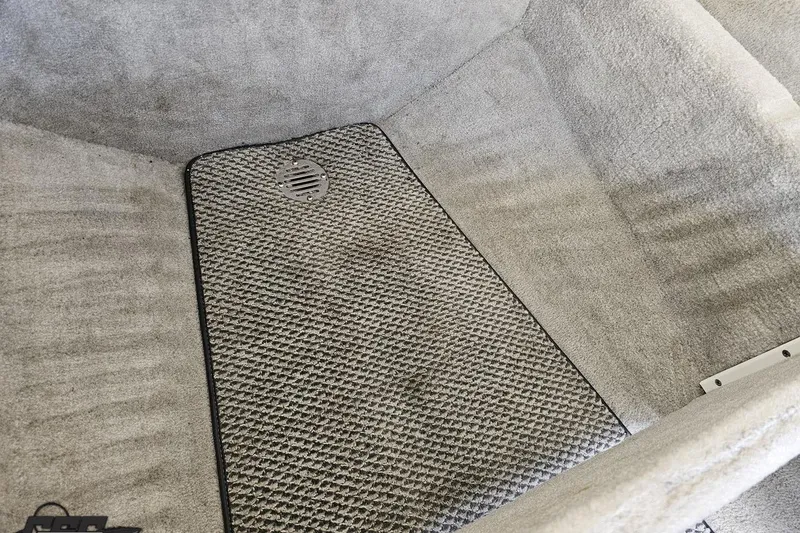 Slide: The Image of Interior of a 2005 Baja 275 boat with textured flooring. - 81