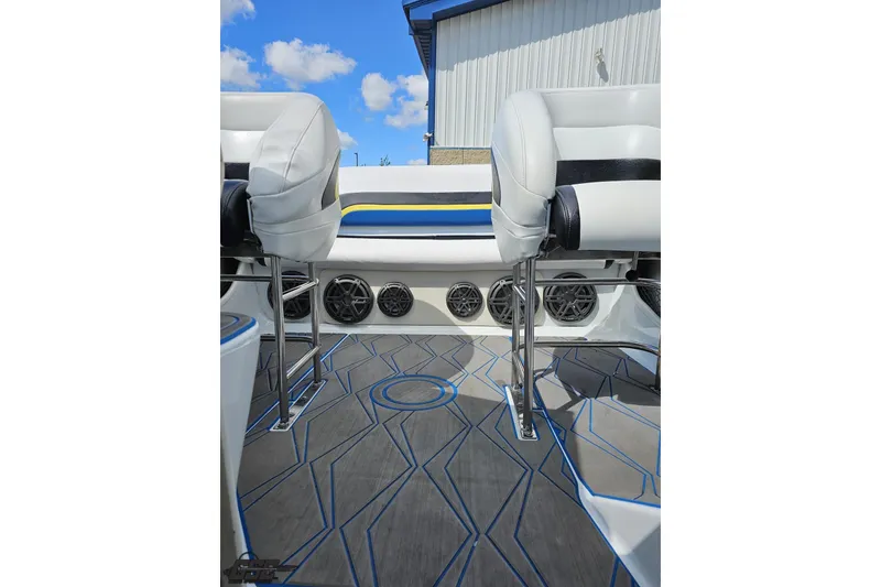 Slide: The Image of 2005 Baja 275 boat interior with stylish seating and modern flooring design. - 82