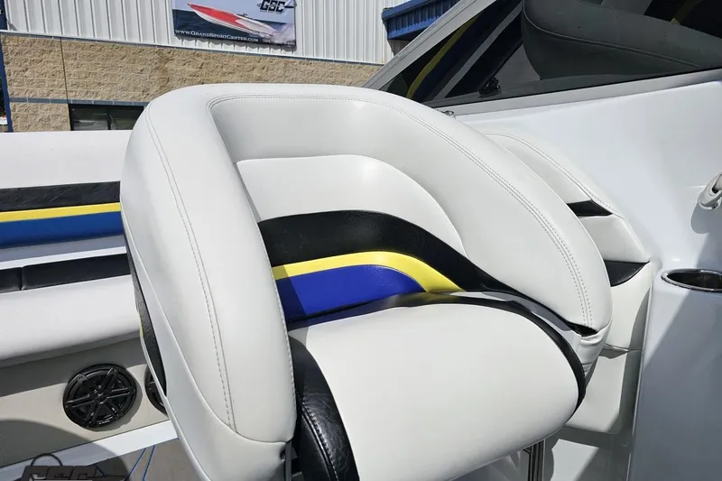Slide: The Image of 2005 Baja 275 boat interior with white, black, and yellow seating, showcasing modern design. - 85