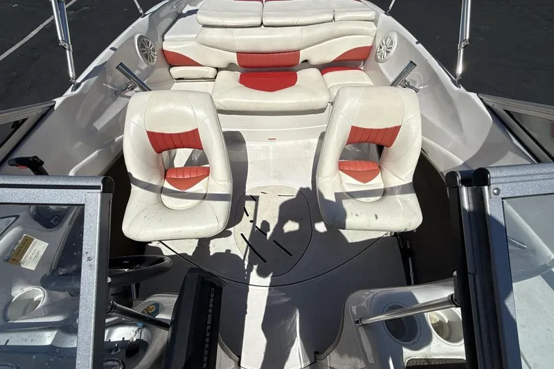 Slide: The Image of Interior of a 2008 Tahoe Q5i SF boat with white and red seating. - 12