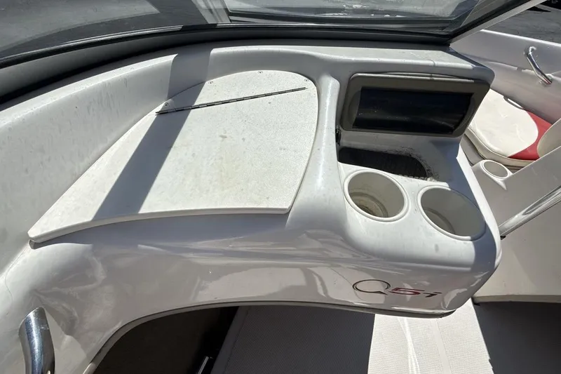 Slide: The Image of 2008 Tahoe Q5i SF boat interior with cup holders and dashboard detail. - 18
