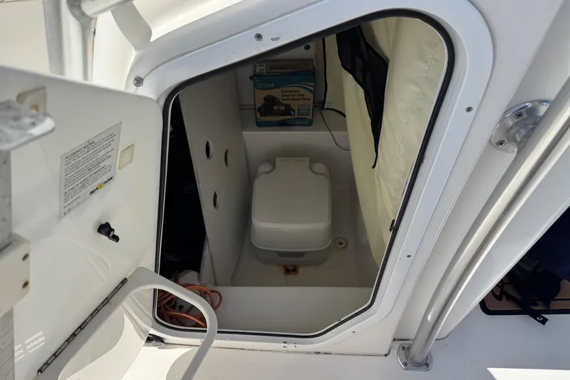 Slide: The Image of 2015 Sea Fox 220 Viper boat interior with compact marine toilet. - 13