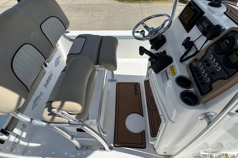 Slide: The Image of 2015 Sea Fox 220 Viper boat interior with steering console and seating. - 18
