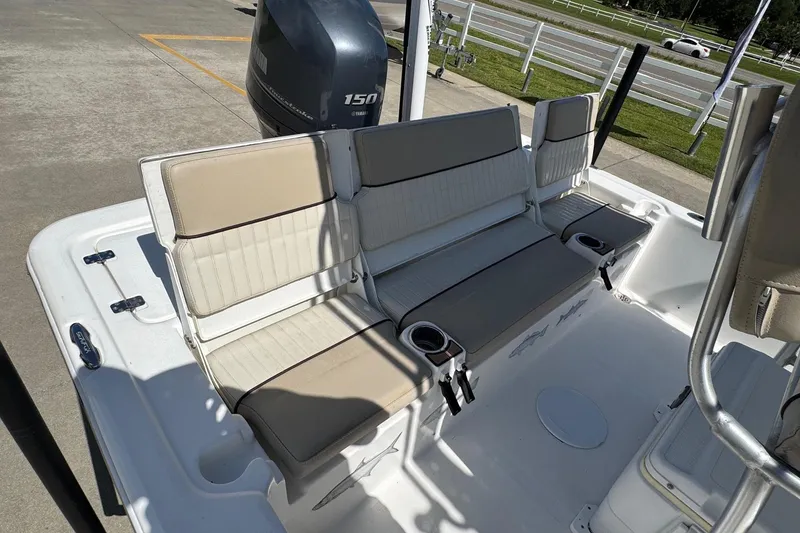 Slide: The Image of 2015 Sea Fox 220 Viper boat interior with beige seating and Yamaha 150 engine. - 20