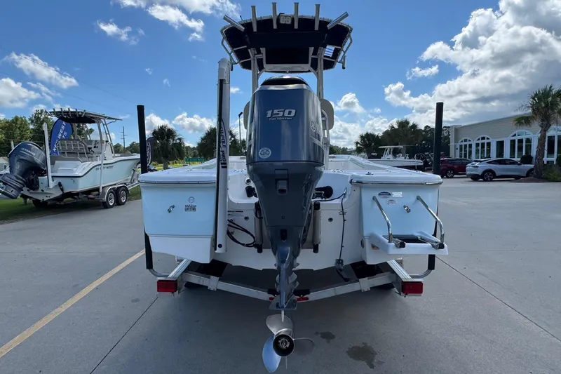 Slide: The Image of 2015 Sea Fox 220 Viper boat with 150 HP engine, parked outdoors. - 3
