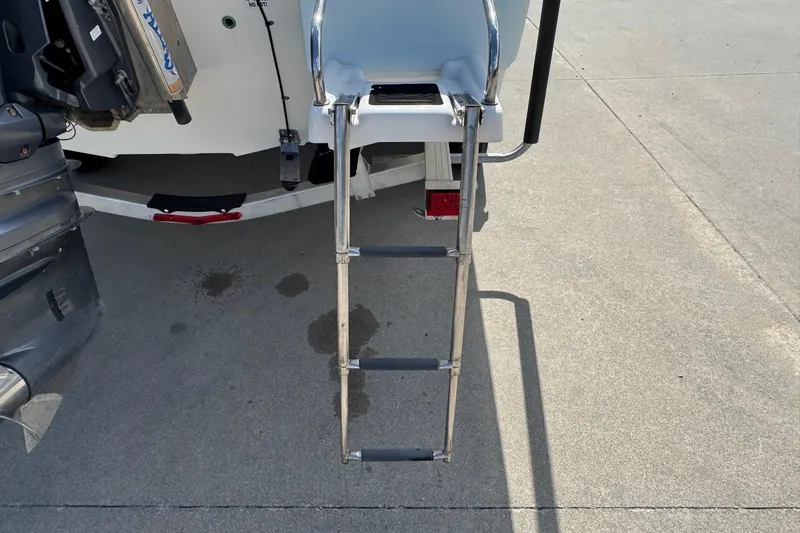 Slide: The Image of Stainless steel boat ladder on 2015 Sea Fox 220 Viper, extended on concrete surface. - 7