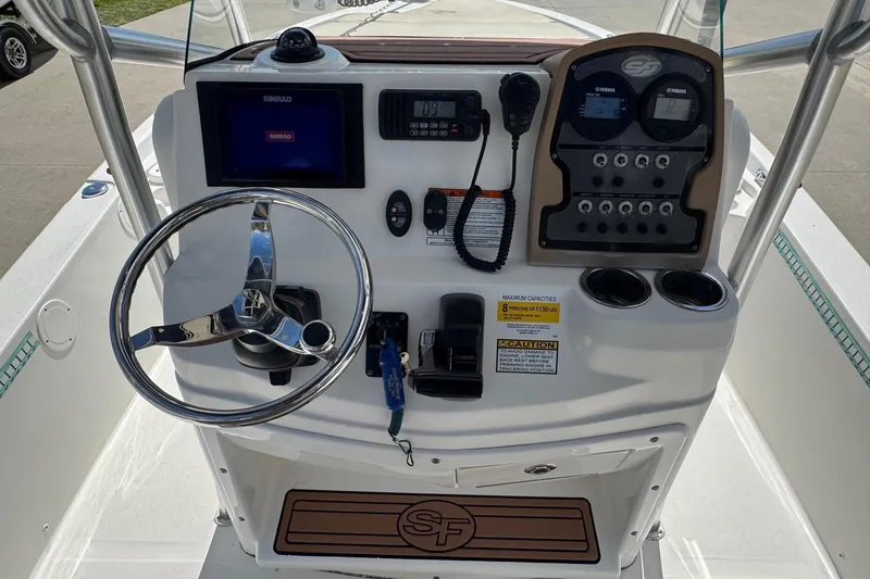 Slide: The Image of 2015 Sea Fox 220 Viper boat console with steering wheel, gauges, and controls. - 9
