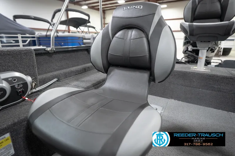 Slide: The Image of 2026 Lund 1650 Rebel XL Sport boat interior with comfortable seating and modern design. - 40