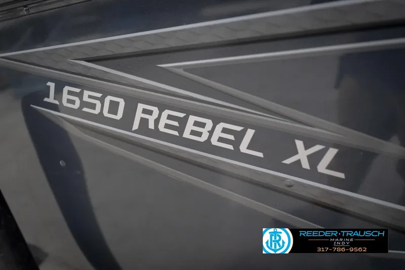 Slide: The Image of 2026 Lund 1650 Rebel XL Sport boat branding with Reeder-Trausch Marine logo. - 51