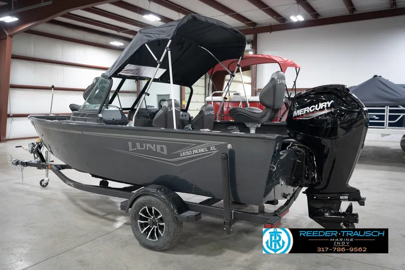 Slide: The Image of 2026 Lund 1650 Rebel XL Sport boat with Mercury engine in showroom. - 8