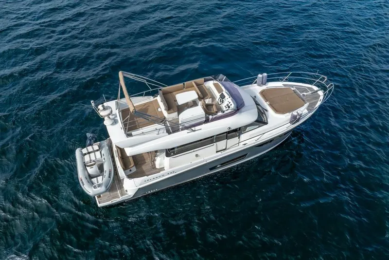Slide: The Image of 2016 Jeanneau Velasco 43F yacht cruising on open water. - 11