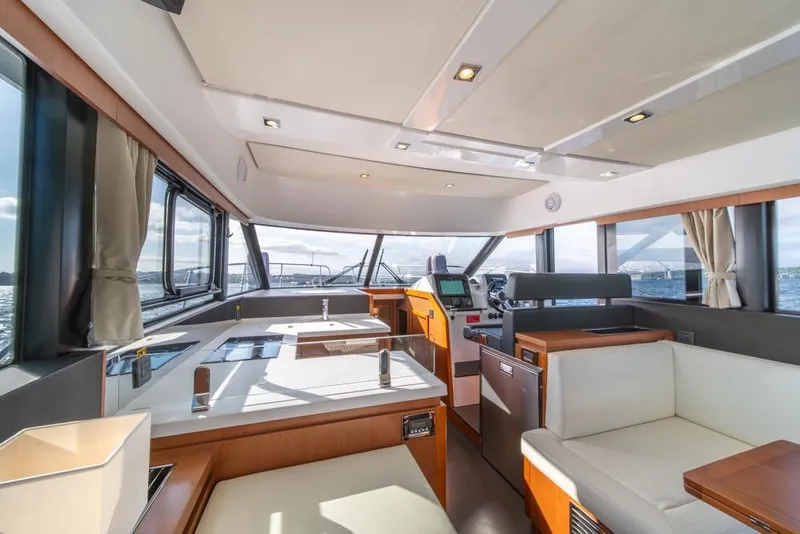 Slide: The Image of Interior of 2016 Jeanneau Velasco 43F yacht with modern design and panoramic windows. - 15