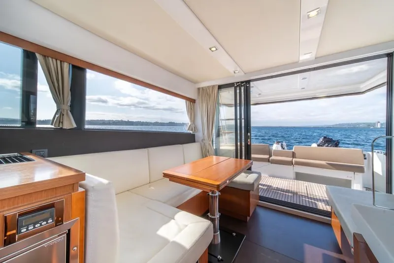 Slide: The Image of Interior of 2016 Jeanneau Velasco 43F yacht with ocean view and elegant seating area. - 21
