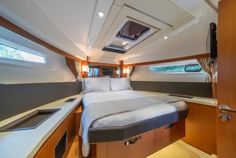Slide: The Image of Luxurious cabin interior of 2016 Jeanneau Velasco 43F yacht with cozy bed and modern design. - 24