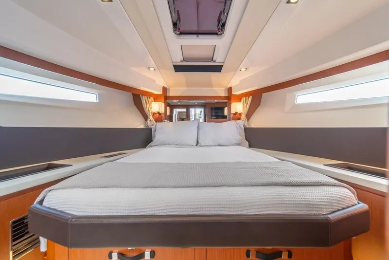 Slide: The Image of Luxurious cabin interior of 2016 Jeanneau Velasco 43F yacht with cozy bedding. - 25