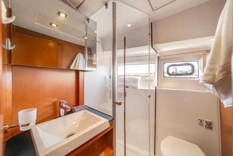 Slide: The Image of Luxurious bathroom interior of 2016 Jeanneau Velasco 43F yacht, featuring modern fixtures and wood accents. - 28