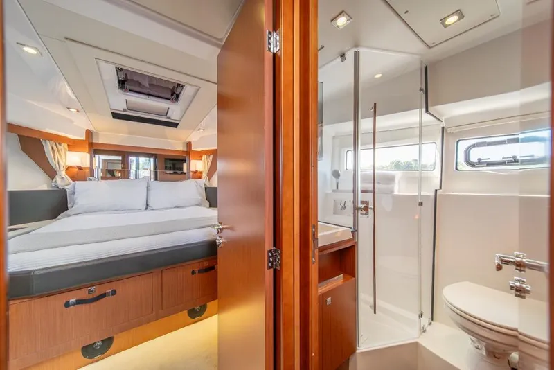 Slide: The Image of Luxurious interior of 2016 Jeanneau Velasco 43F yacht with bedroom and bathroom. - 29