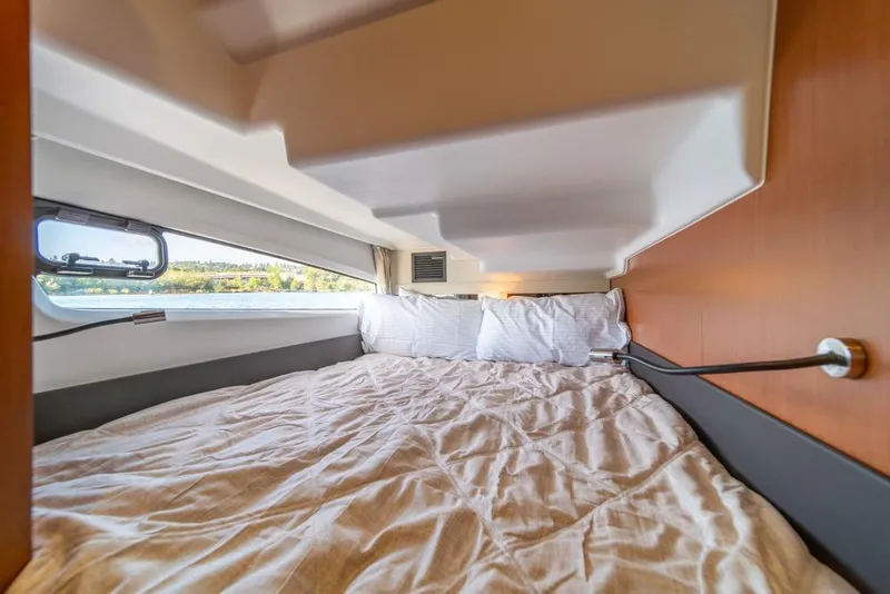 Slide: The Image of Cozy cabin interior of 2016 Jeanneau Velasco 43F yacht with scenic window view. - 30