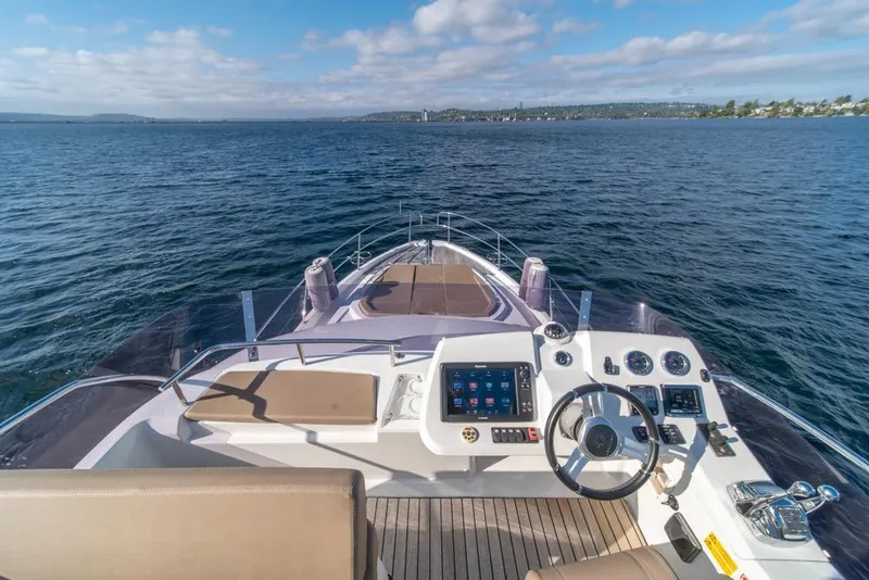 Slide: The Image of 2016 Jeanneau Velasco 43F yacht helm with panoramic ocean view. - 32