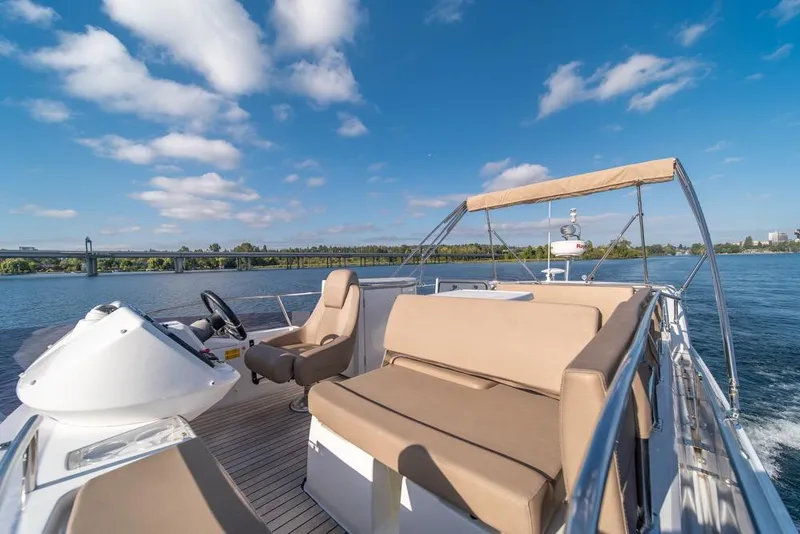 Slide: The Image of 2016 Jeanneau Velasco 43F yacht cruising on a sunny day with clear blue skies. - 35
