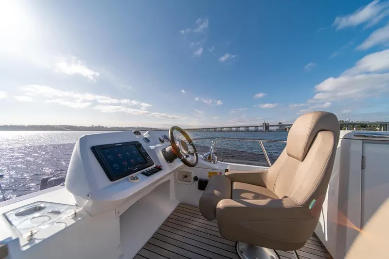 Slide: The Image of Helm of 2016 Jeanneau Velasco 43F yacht with scenic water view. - 37