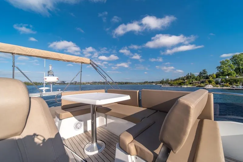 Slide: The Image of Flybridge seating area on 2016 Jeanneau Velasco 43F yacht, with scenic water view. - 41