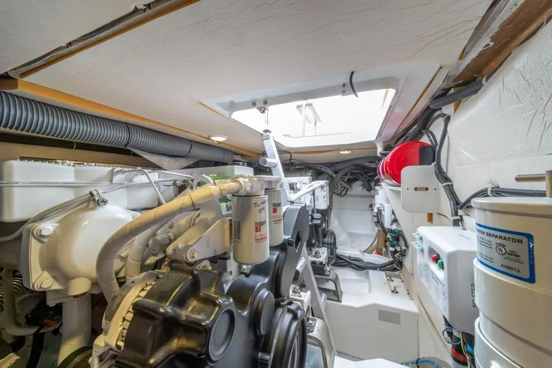 Slide: The Image of Engine room of 2016 Jeanneau Velasco 43F yacht, showcasing mechanical components and systems. - 50