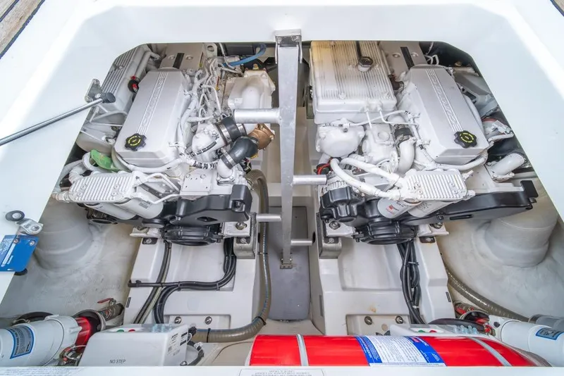 Slide: The Image of Engine compartment of 2016 Jeanneau Velasco 43F, showcasing dual engines and mechanical components. - 51