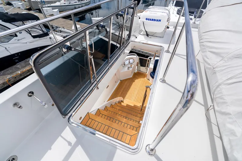 Slide: The Image of Stairway on 2013 Ocean Alexander 72 Pilothouse yacht, leading to lower deck interior. - 11