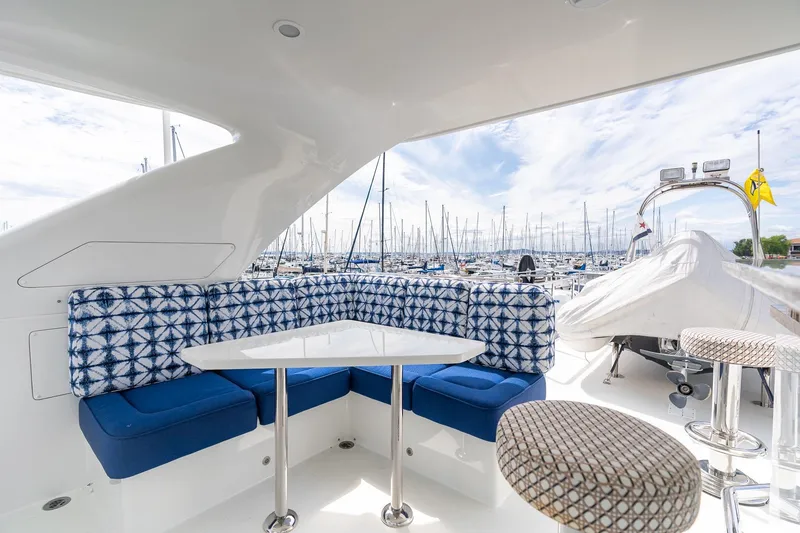 Slide: The Image of Luxurious 2013 Ocean Alexander 72 Pilothouse yacht with stylish outdoor seating and marina view. - 15