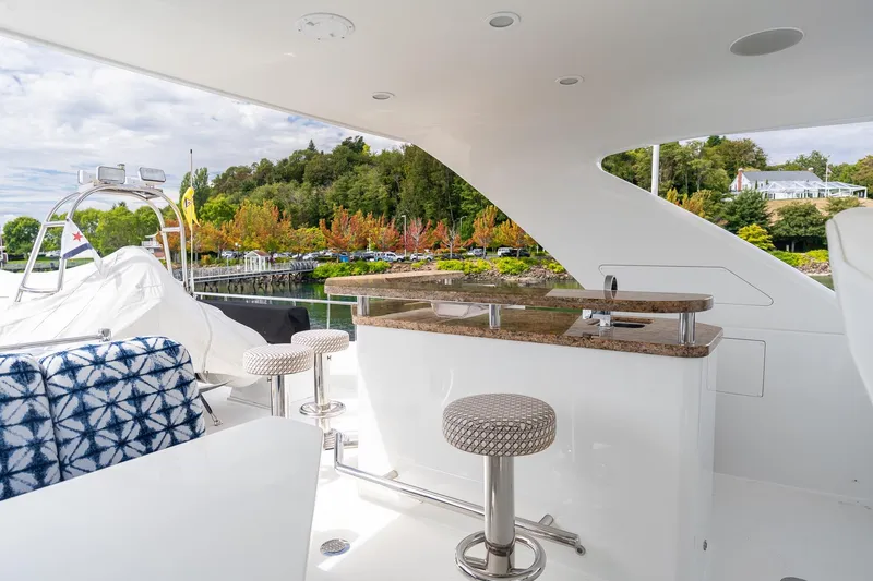 Slide: The Image of Luxurious 2013 Ocean Alexander 72 Pilothouse yacht with outdoor seating and bar area. - 16