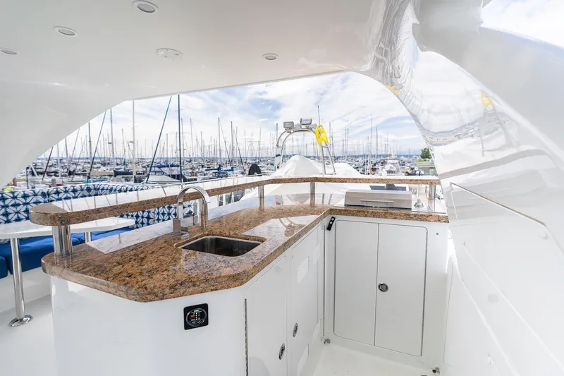 Slide: The Image of Luxurious 2013 Ocean Alexander 72 Pilothouse yacht with elegant outdoor bar and marina view. - 17