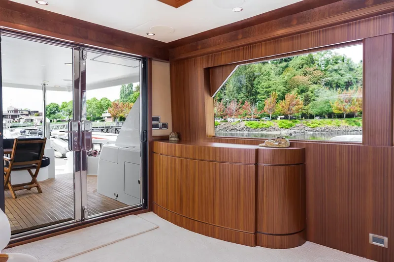 Slide: The Image of Luxurious interior of 2013 Ocean Alexander 72 Pilothouse yacht with wood paneling and large window. - 23