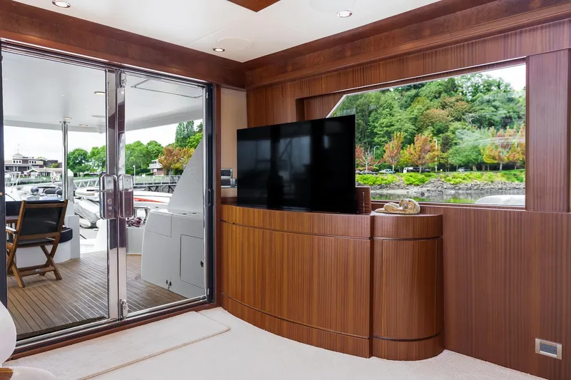 Slide: The Image of Luxurious interior of 2013 Ocean Alexander 72 Pilothouse yacht with wood paneling and large window. - 24