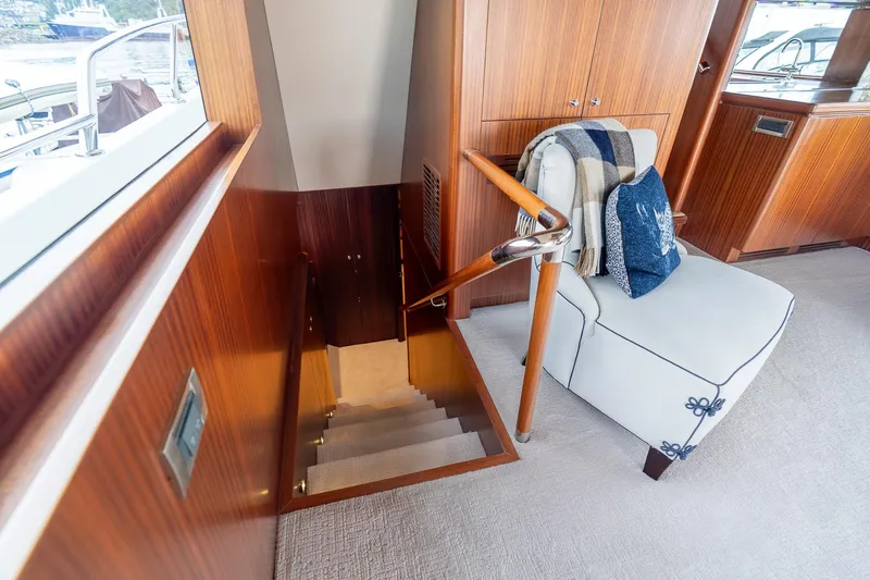 Slide: The Image of Luxurious interior of 2013 Ocean Alexander 72 Pilothouse yacht with elegant staircase and seating. - 26