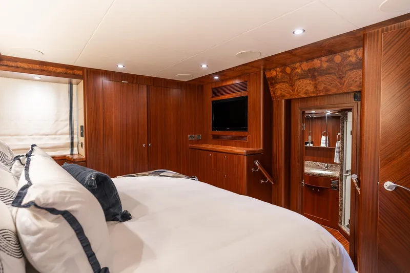 Slide: The Image of Luxurious bedroom in 2013 Ocean Alexander 72 Pilothouse yacht with elegant wood finishes. - 28
