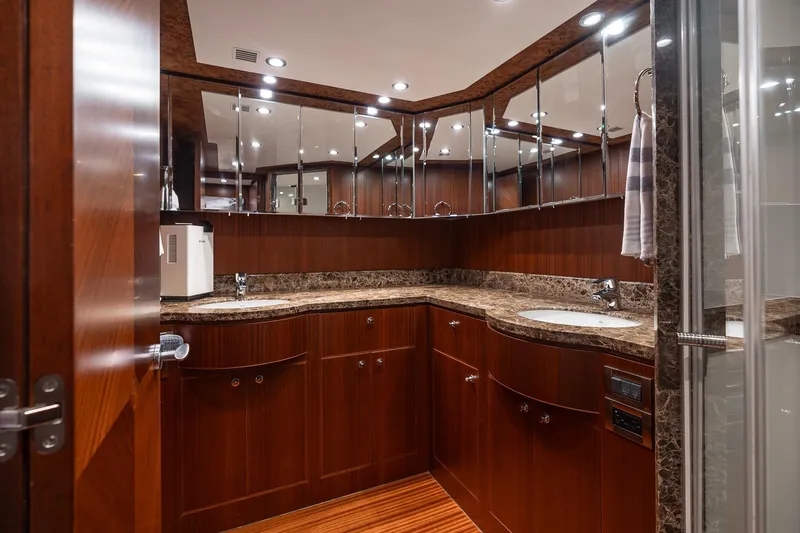 Slide: The Image of Luxurious bathroom in 2013 Ocean Alexander 72 Pilothouse yacht with wood cabinetry and marble countertops. - 32