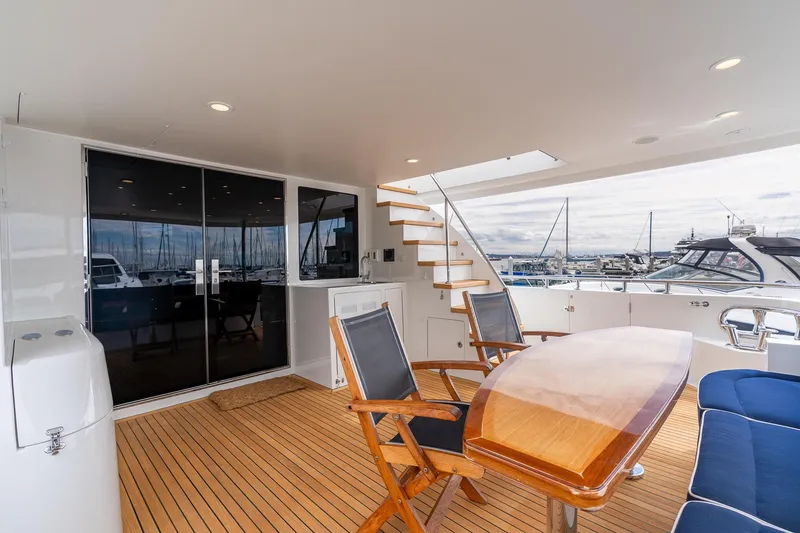 Slide: The Image of Luxurious 2013 Ocean Alexander 72 Pilothouse yacht deck with seating and marina view. - 4