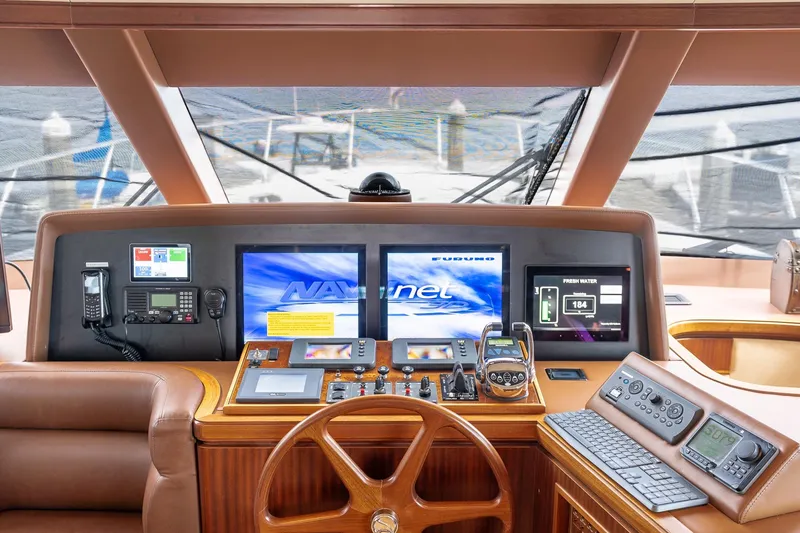 Slide: The Image of Pilothouse of 2013 Ocean Alexander 72, featuring advanced navigation and control systems. - 40