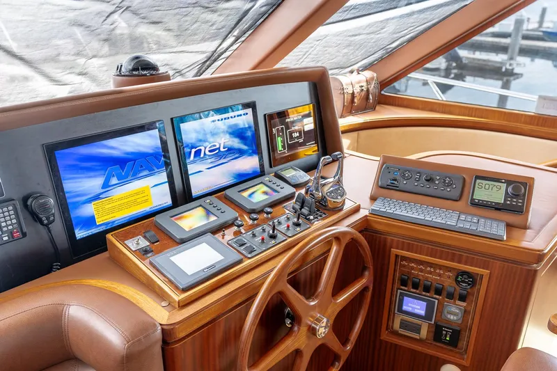 Slide: The Image of Pilothouse of 2013 Ocean Alexander 72, featuring advanced navigation and control systems. - 41