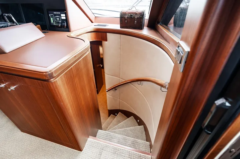 Slide: The Image of Luxurious interior staircase of 2013 Ocean Alexander 72 Pilothouse yacht, featuring elegant wood finish. - 43