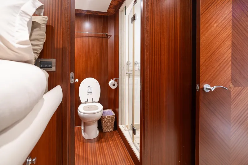 Slide: The Image of Luxurious bathroom in 2013 Ocean Alexander 72 Pilothouse yacht with wood paneling and modern fixtures. - 46