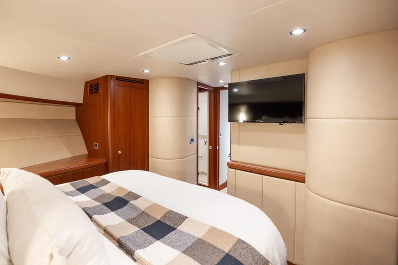 Slide: The Image of Luxurious bedroom interior of 2013 Ocean Alexander 72 Pilothouse yacht with TV and elegant decor. - 49