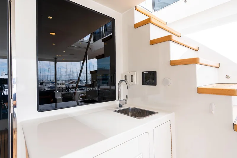 Slide: The Image of Ocean Alexander 72 Pilothouse 2013 yacht interior with sink and wooden stairs. - 5