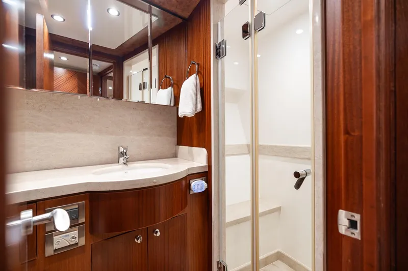 Slide: The Image of Luxurious bathroom in 2013 Ocean Alexander 72 Pilothouse yacht with wood accents and modern fixtures. - 50