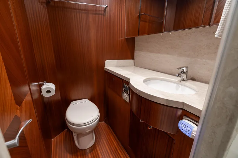 Slide: The Image of Luxurious bathroom in 2013 Ocean Alexander 72 Pilothouse yacht with wood finish and modern fixtures. - 51