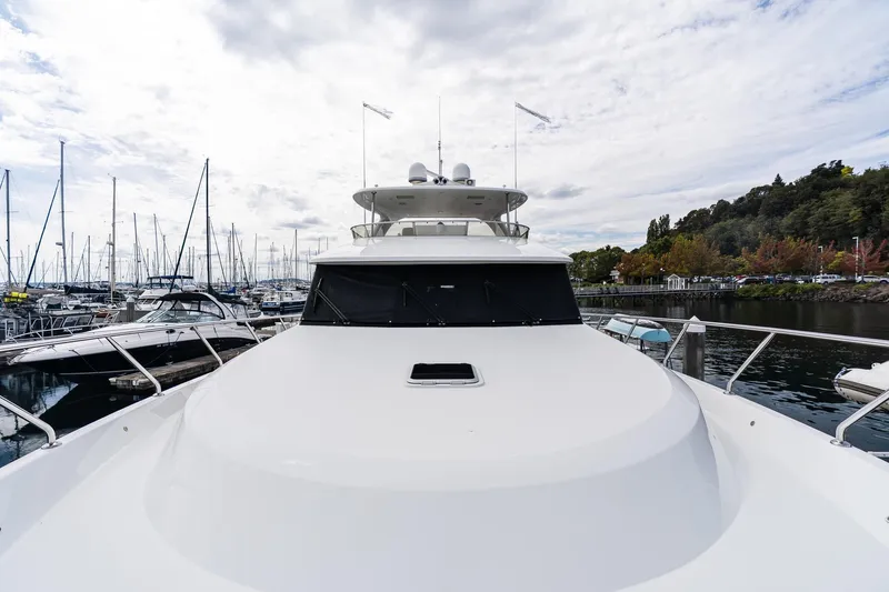 Slide: The Image of 2013 Ocean Alexander 72 Pilothouse yacht docked at marina, surrounded by boats. - 52