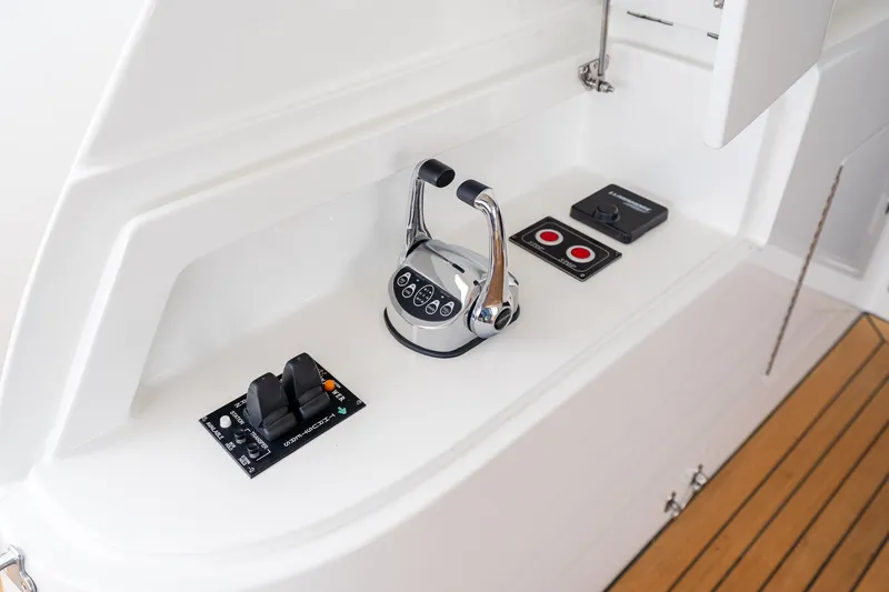 Slide: The Image of Control panel of 2013 Ocean Alexander 72 Pilothouse yacht with throttle and switches. - 6